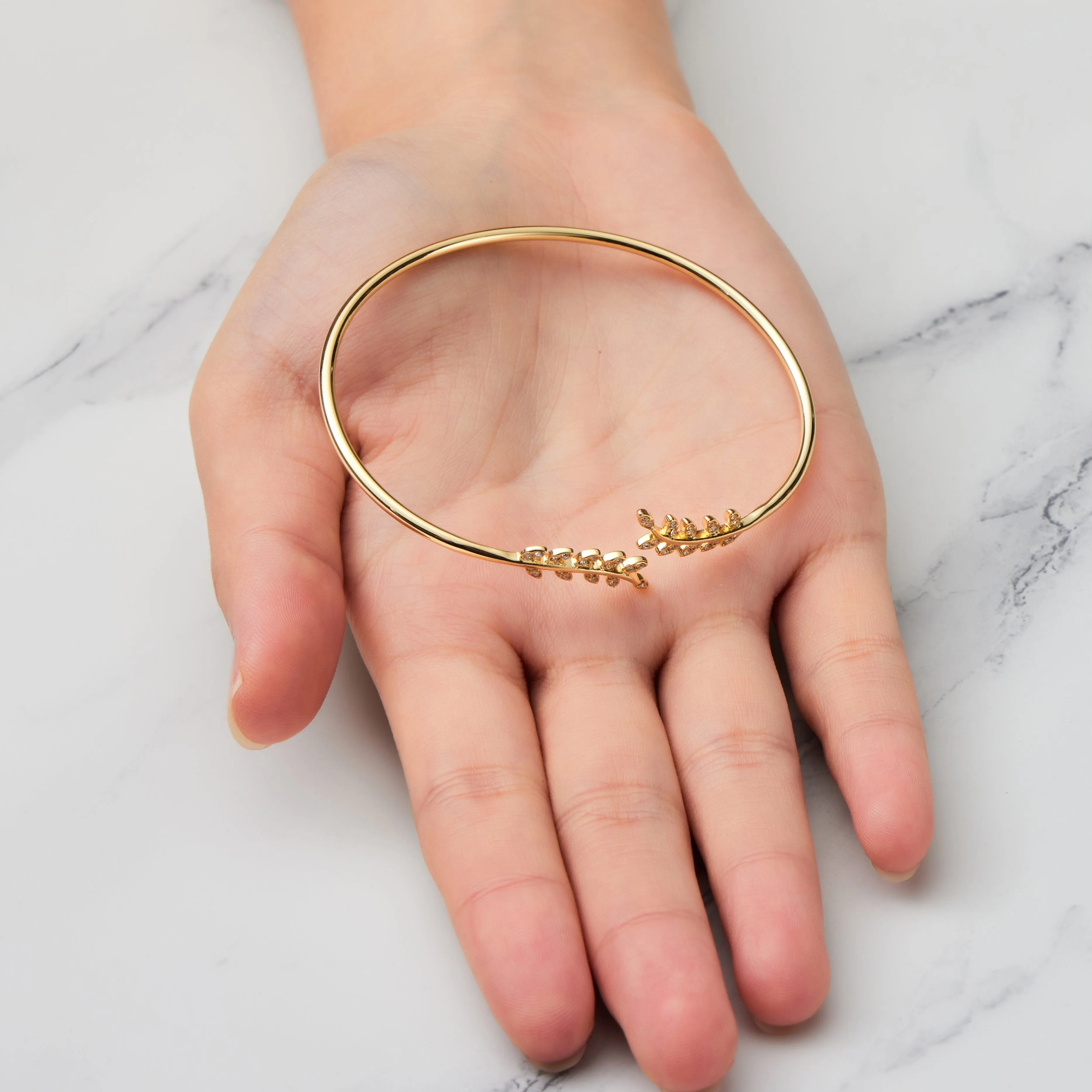 Gold Plated Leaf Bangle Created with Zircondia® Crystals